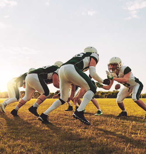 high school football players practicing